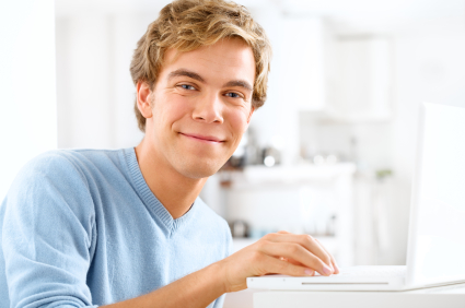 Gentleman using laptop for Final Cut Pro training courses online.